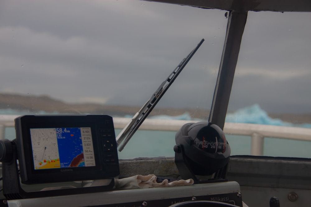 a boat with a gps device on the front of it