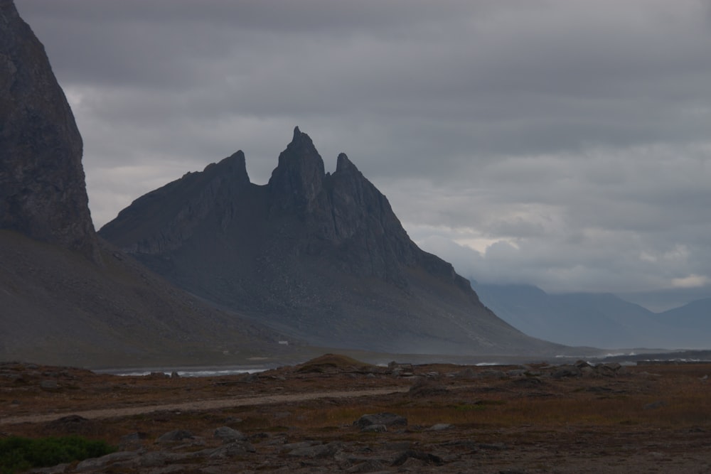 a couple of mountains that are next to a body of water