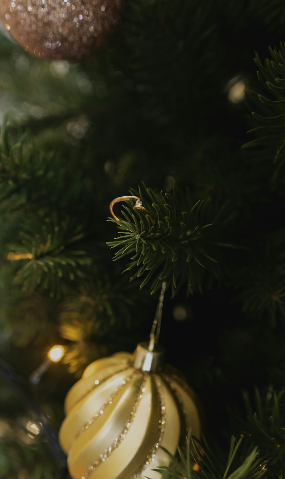 a close up of a christmas tree with ornaments