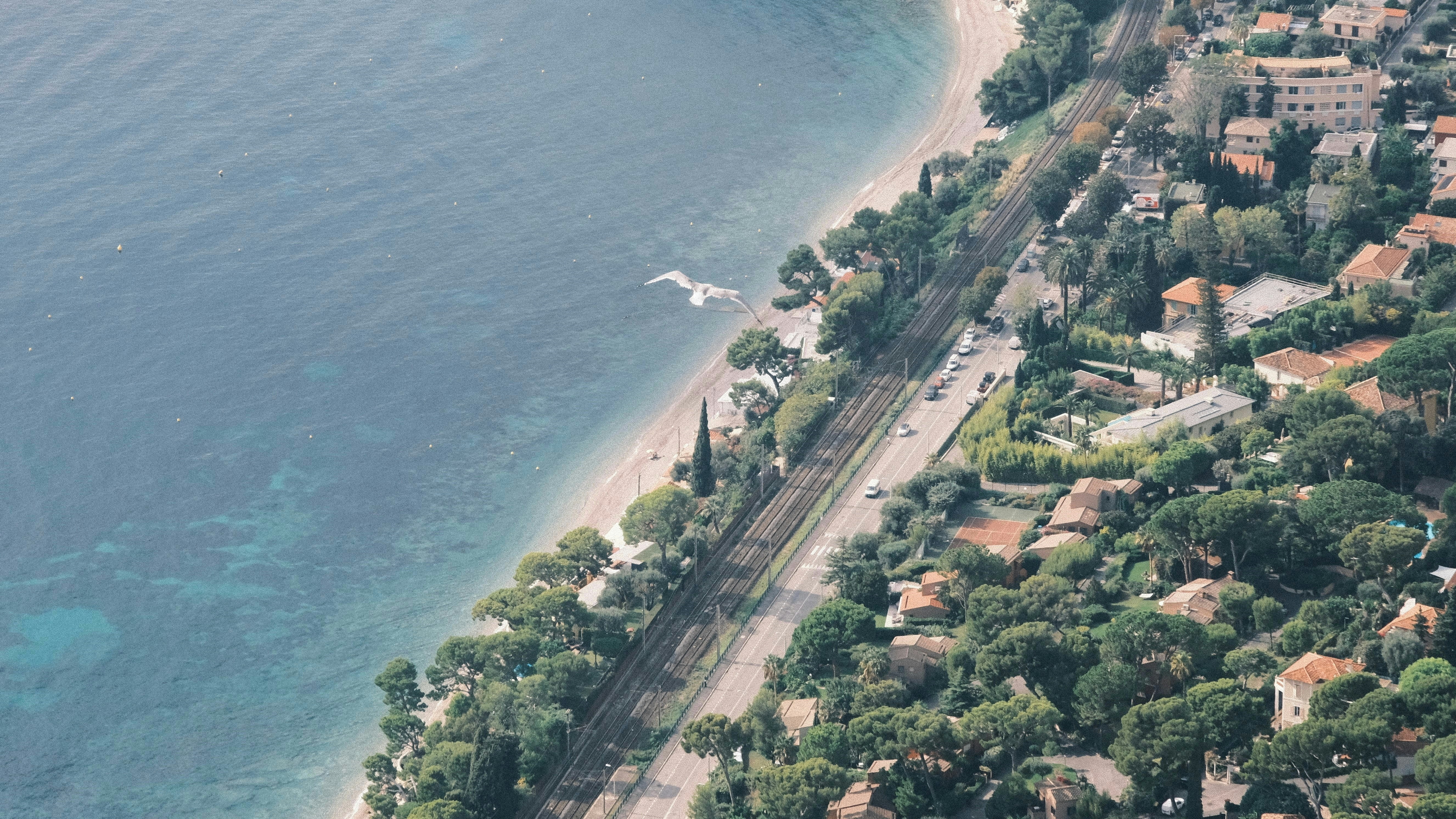 a bird's eye view of a small town by the ocean