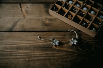 A variety of open box items displayed on a wooden table.