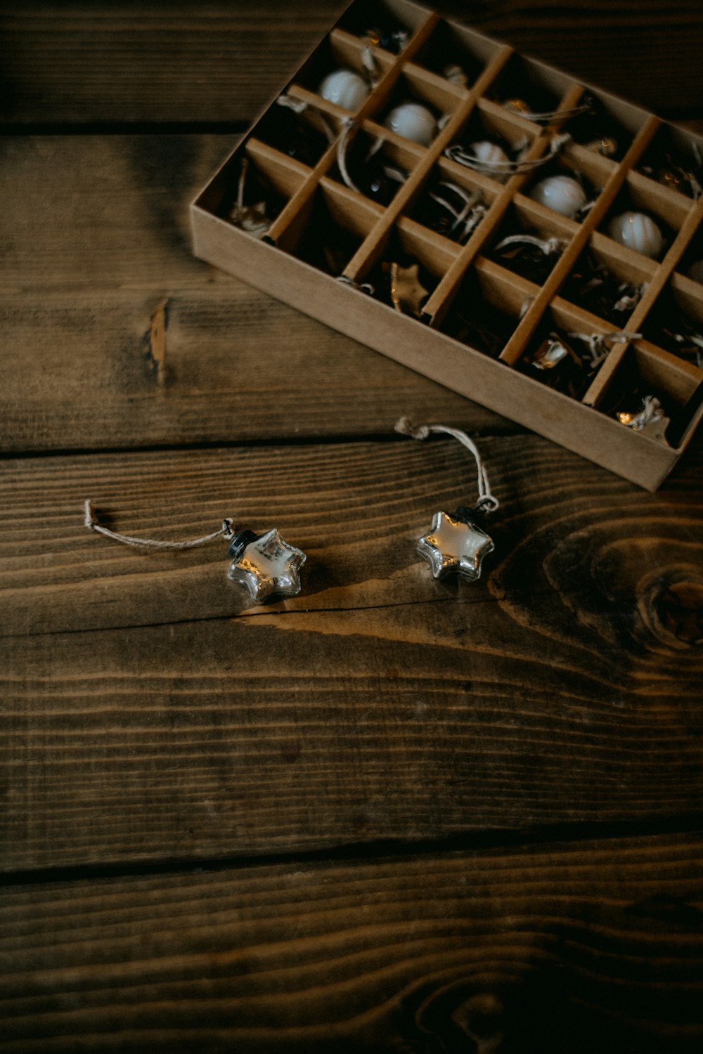 a box of christmas ornaments on a wooden table