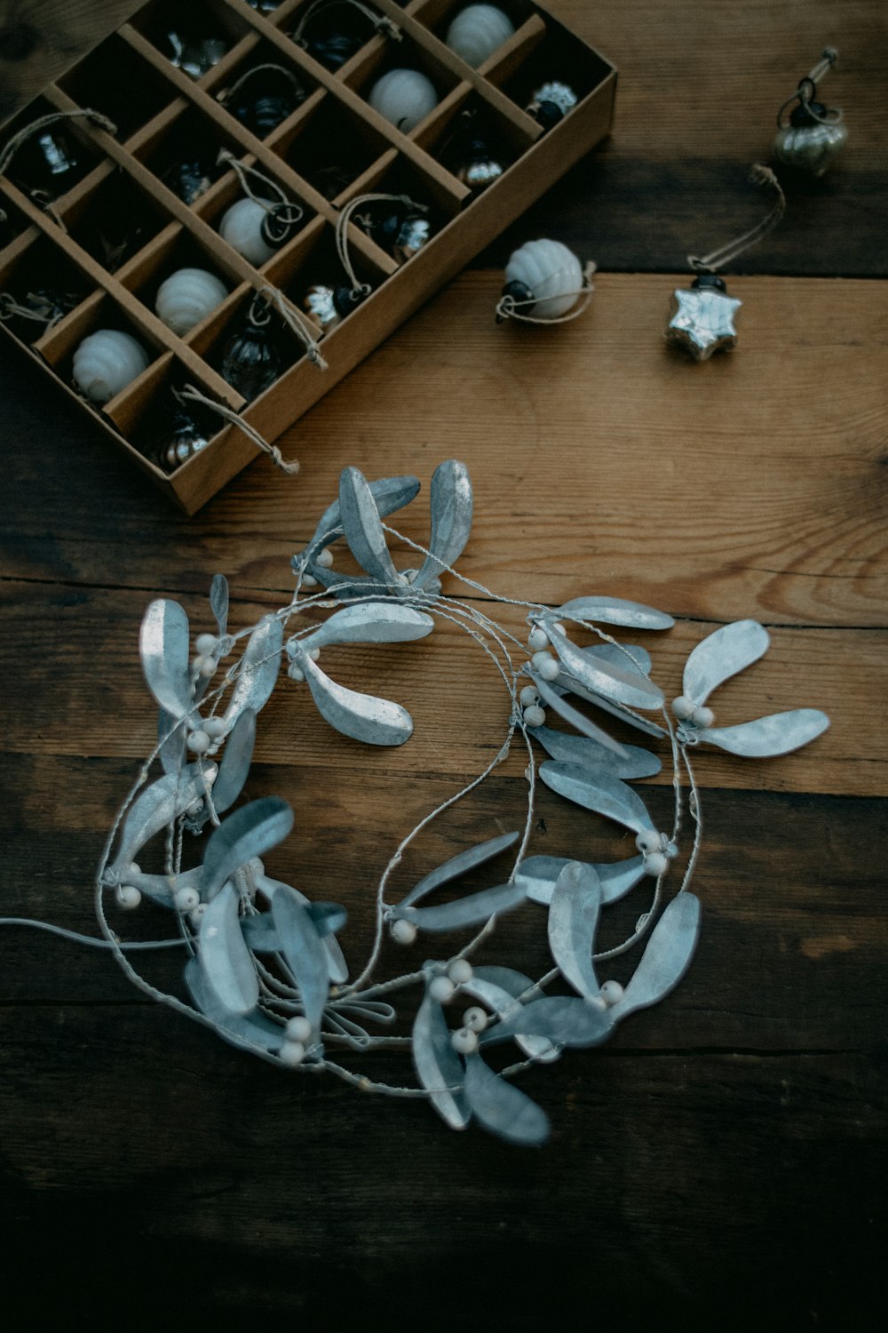 a bunch of ornaments sitting on top of a wooden table