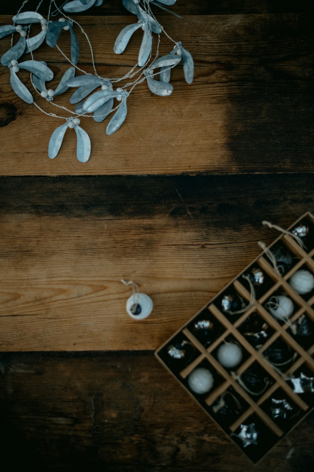 a wooden table topped with a vase filled with flowers