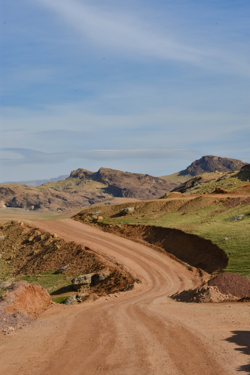 a dirt road in the middle of the desert