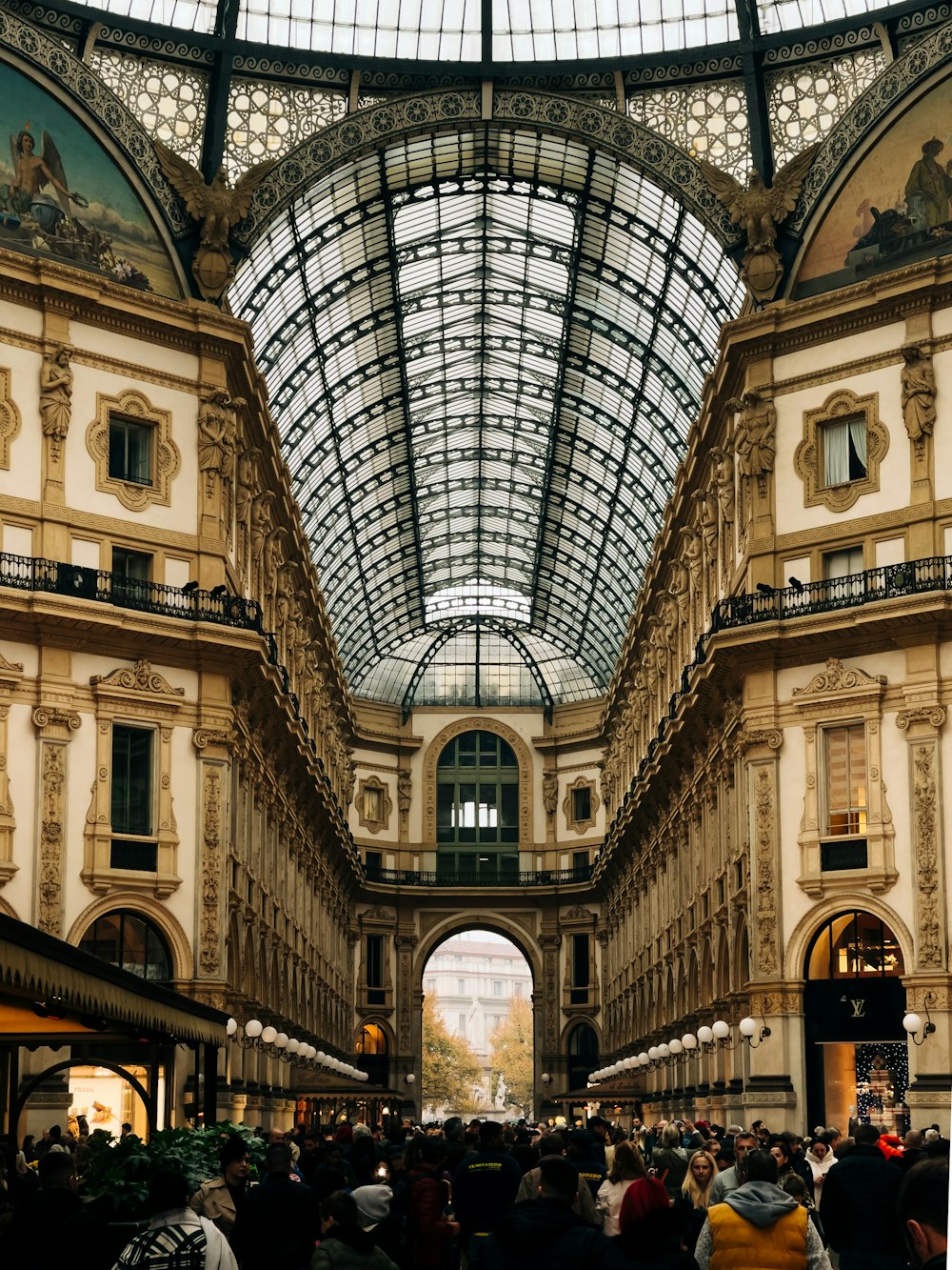 a group of people standing inside of a building