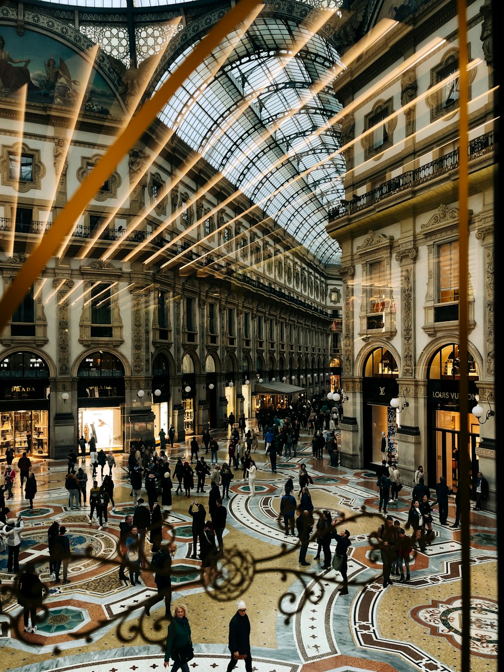 a group of people walking around a building