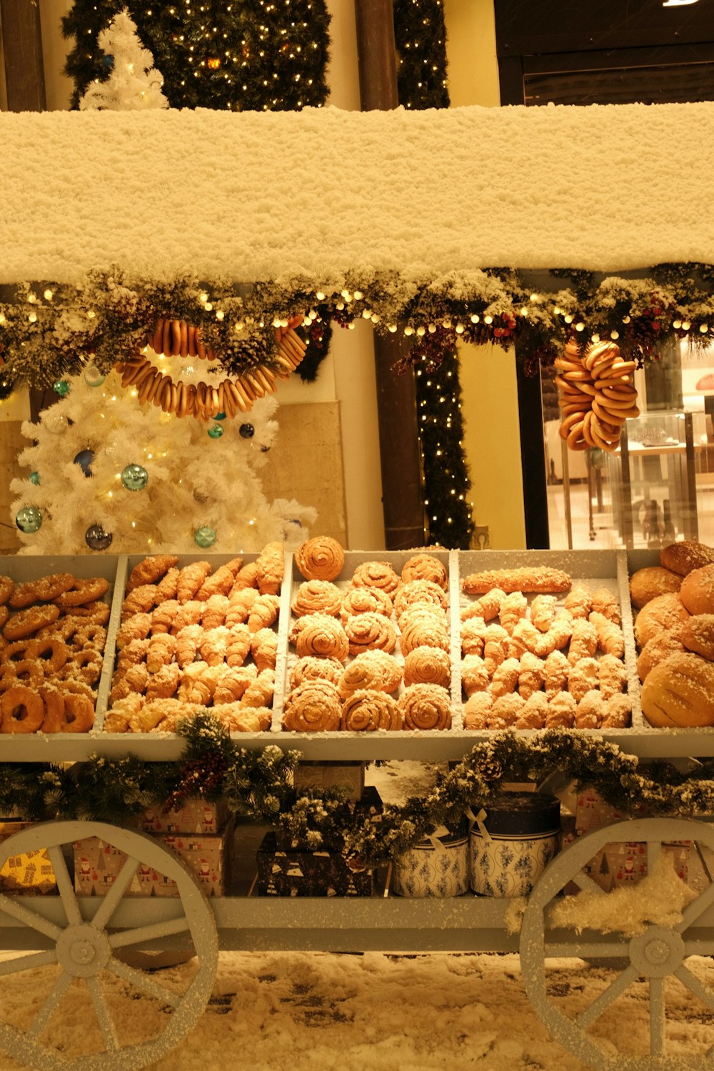a display case filled with lots of different kinds of doughnuts