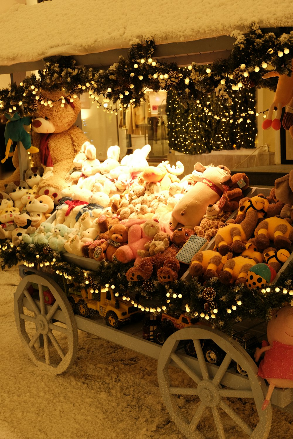 a wagon filled with lots of stuffed animals