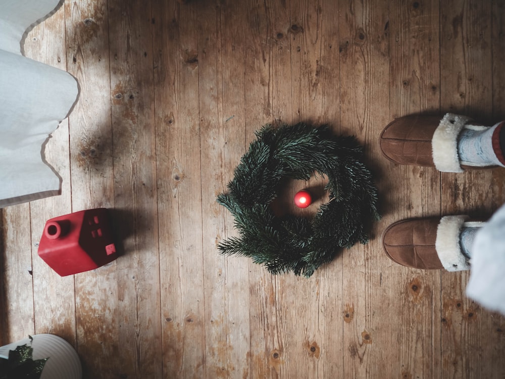 two people standing next to each other on a wooden floor