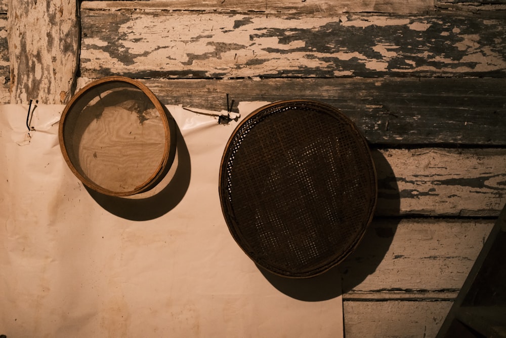 two baskets hanging on a wall next to a door