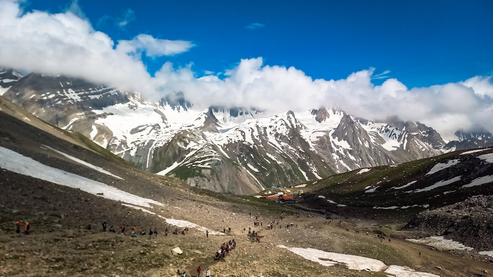 a group of people hiking up a mountain