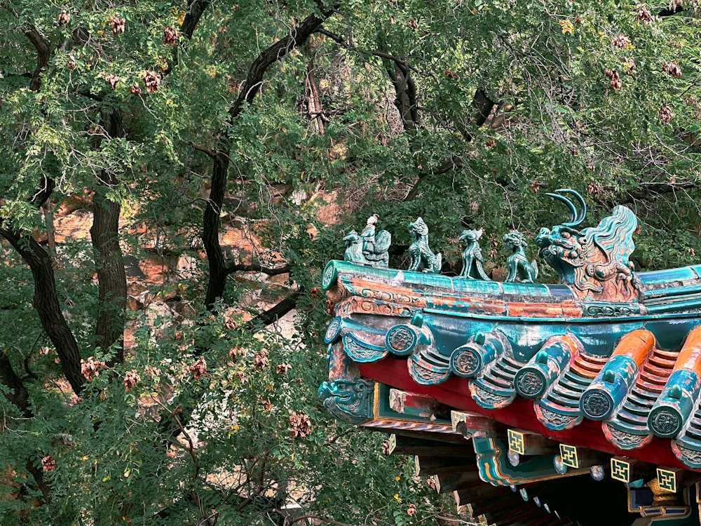 a colorful roof with statues on top of it