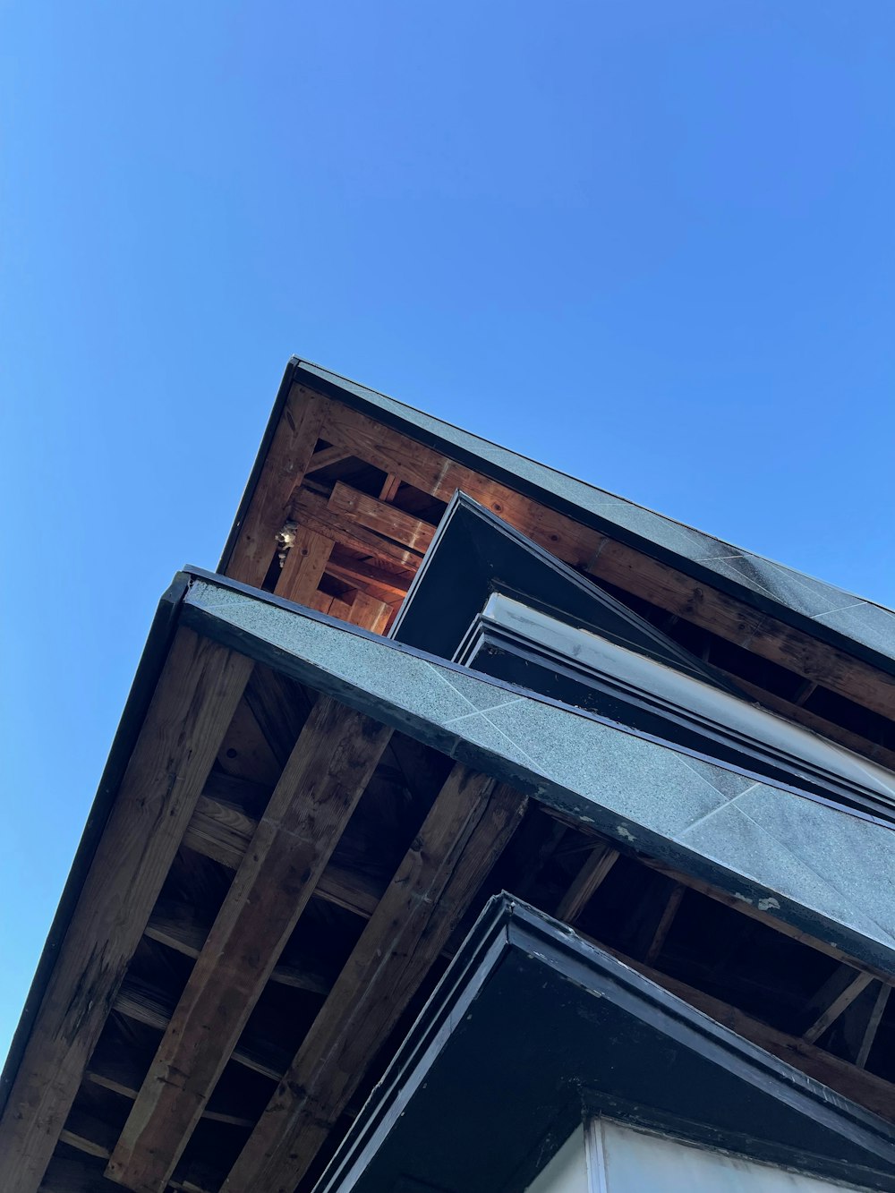 the roof of a building with a sky background