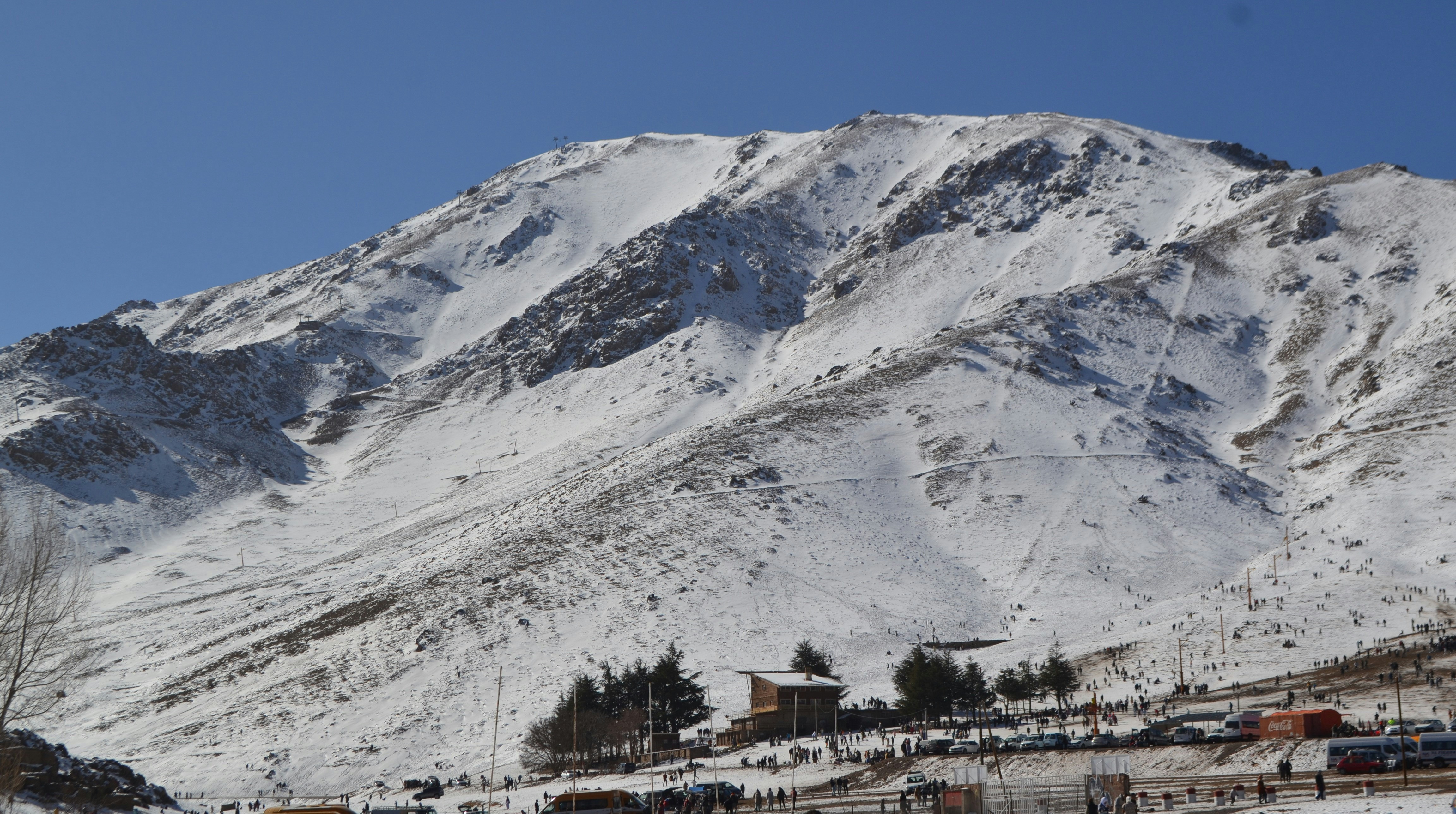 Auli skiing destination with snow-covered slopes and adventure enthusiasts enjoying winter sports activities