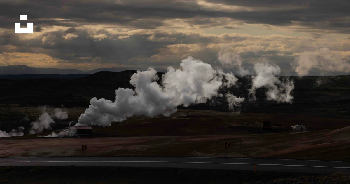 A large group of steam rises from the ground photo – Free Island Image ...