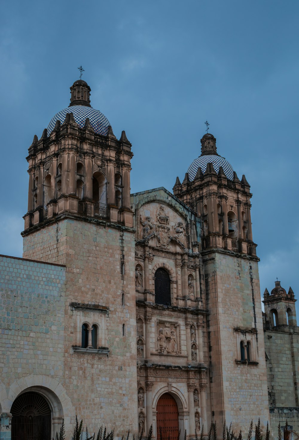 a large building with two towers on top of it