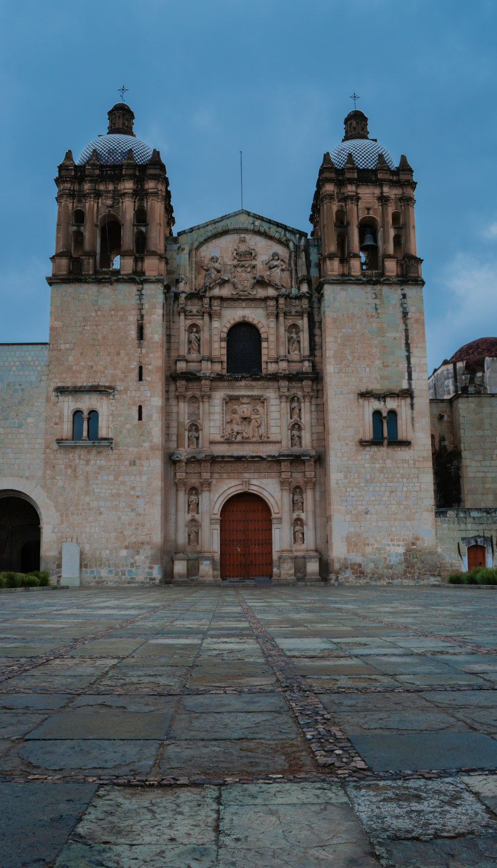 a large building with two towers on top of it