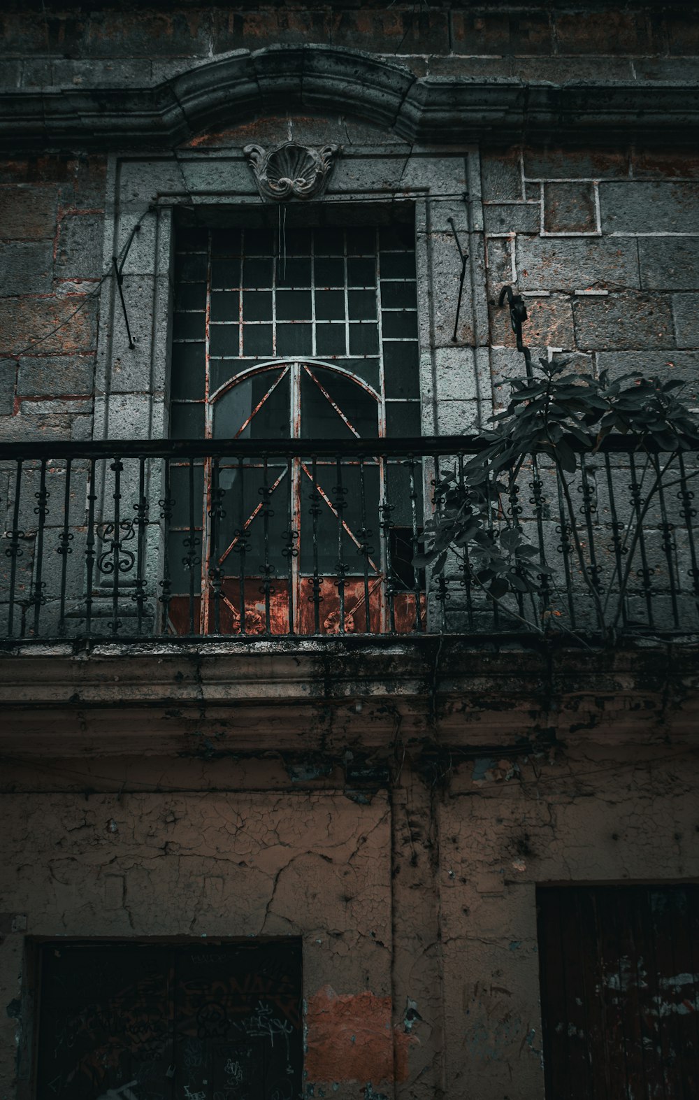 an old building with a wrought iron balcony