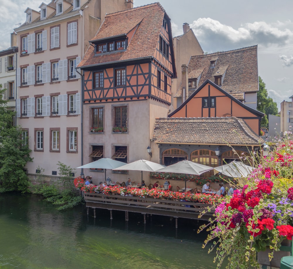 a group of buildings next to a body of water