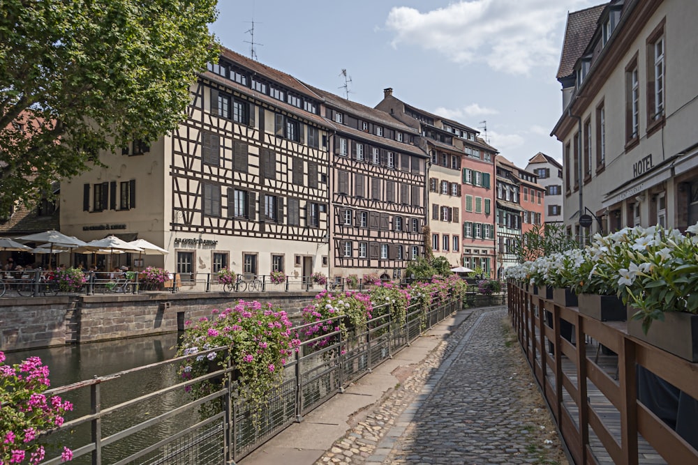 a river running through a city next to tall buildings