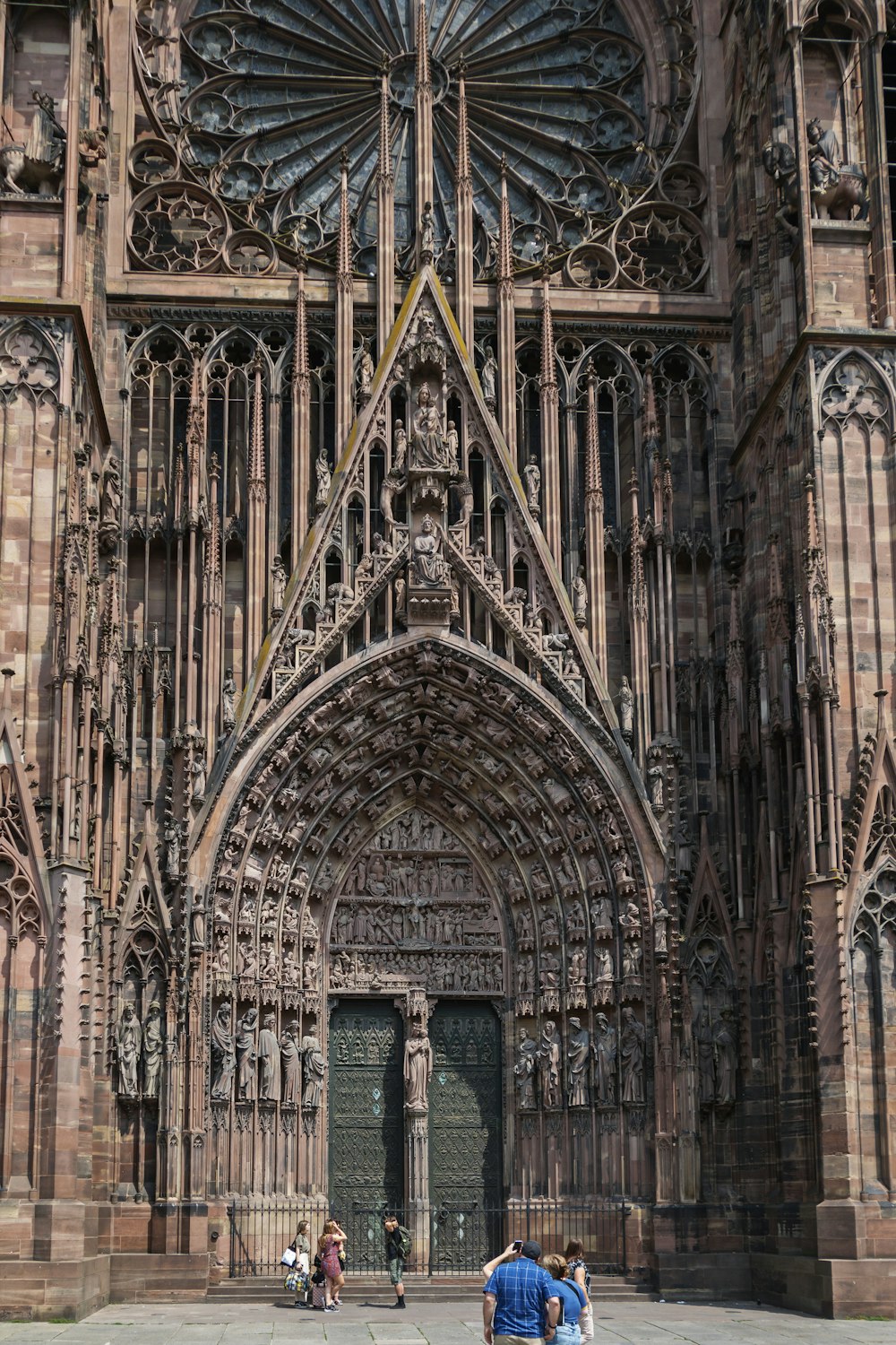 a couple of people standing in front of a large building