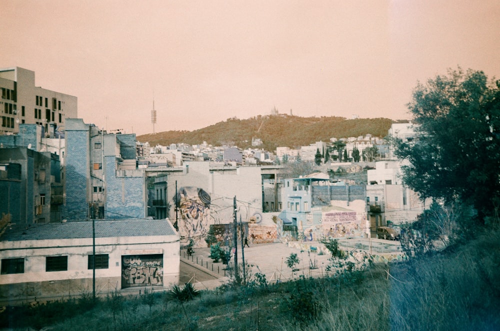 a view of a city with a hill in the background
