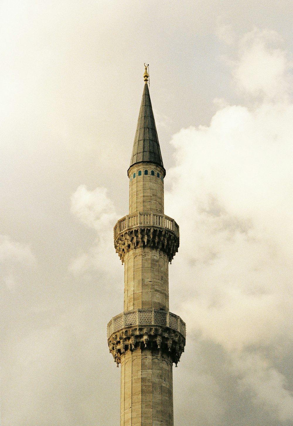 a tall tower with a clock on top of it