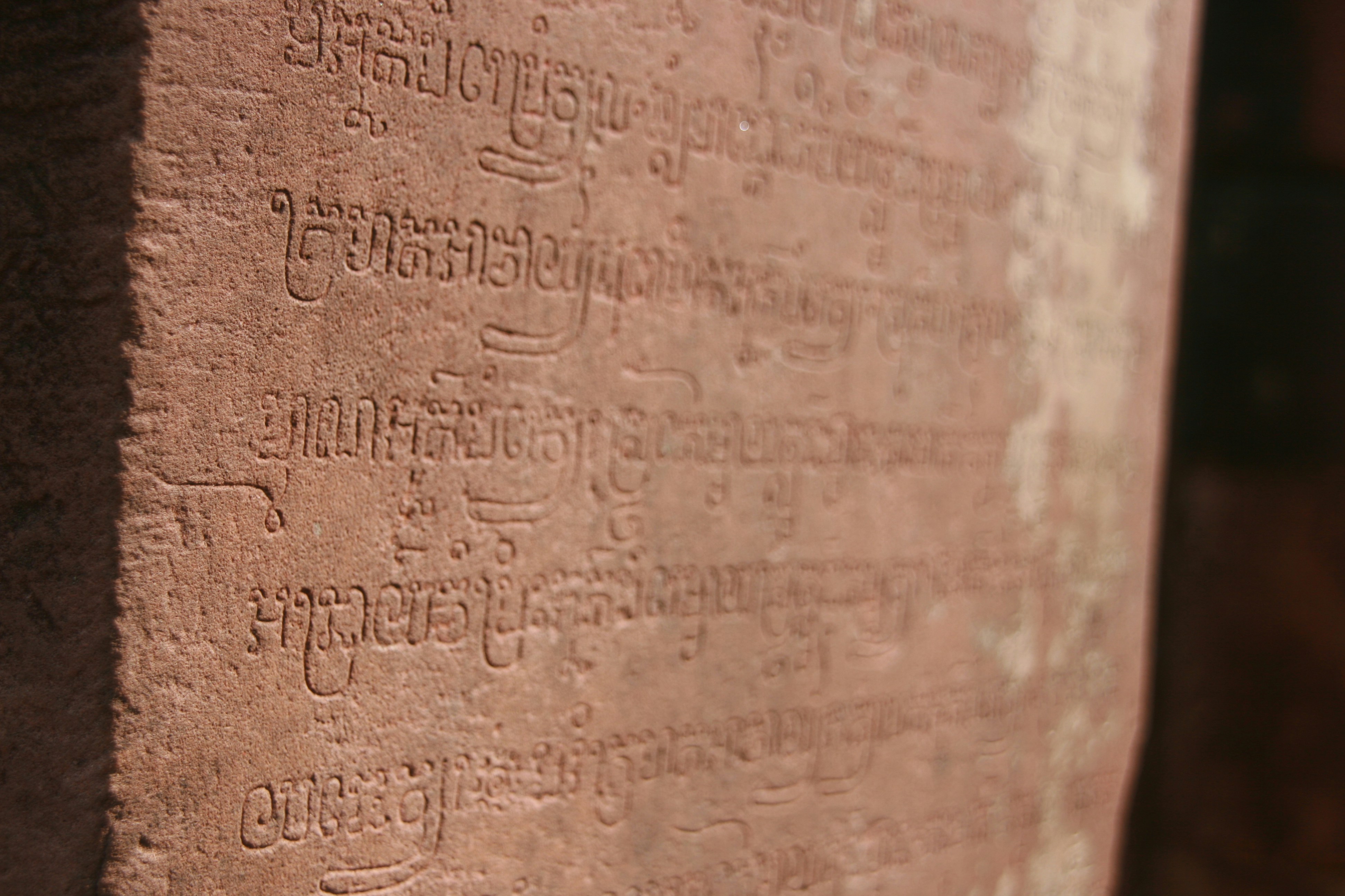 a close up of a wall with writing on it