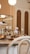 A cozy bakery interior with warm lighting and a display of various pastries.