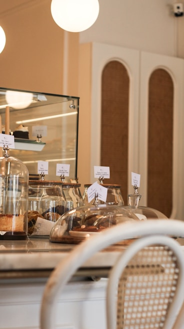 Inviting café corner with plush chairs and fresh pastries on display