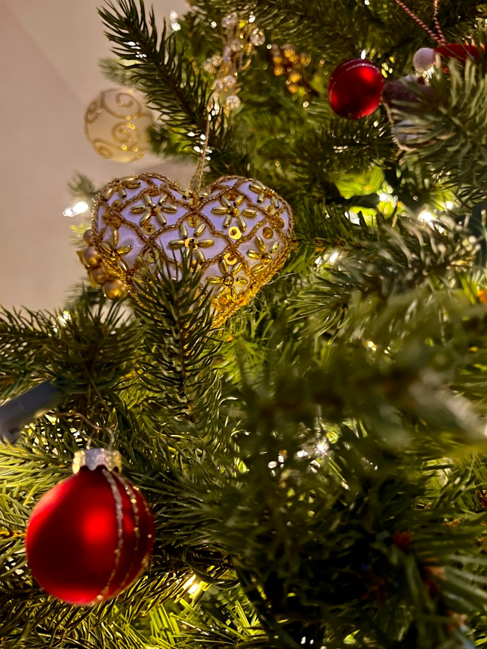 a close up of a christmas tree with ornaments