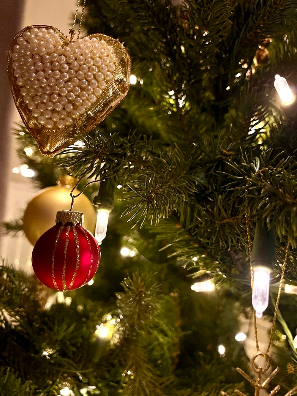 a close up of a christmas tree with ornaments