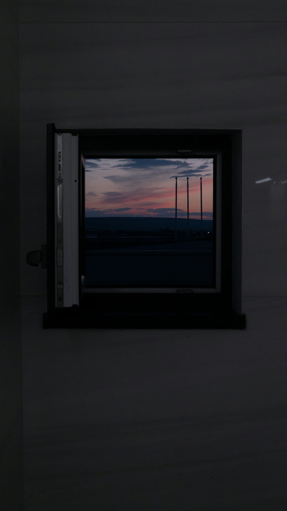 a window with a view of a sunset