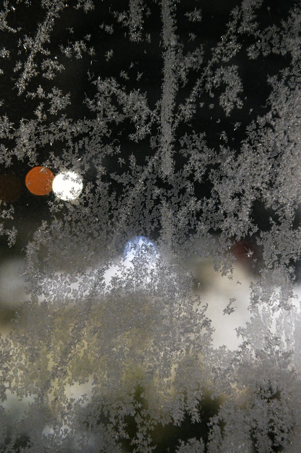 a street light is seen through a frosted window