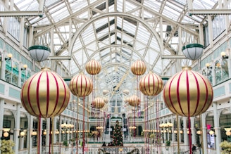 a mall filled with lots of christmas decorations