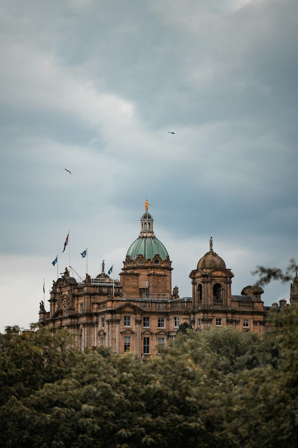 a large building with a green dome on top of it