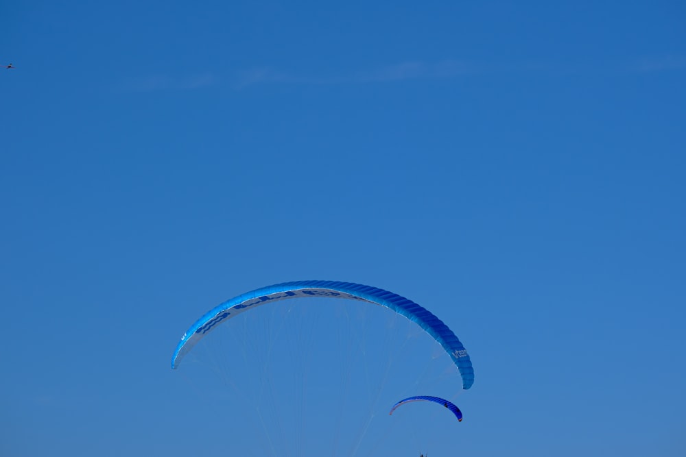 a couple of kites that are flying in the sky