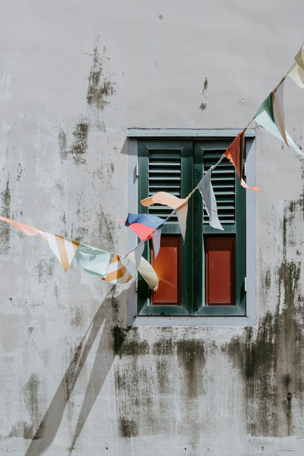 a wall with a window and a bunch of streamers