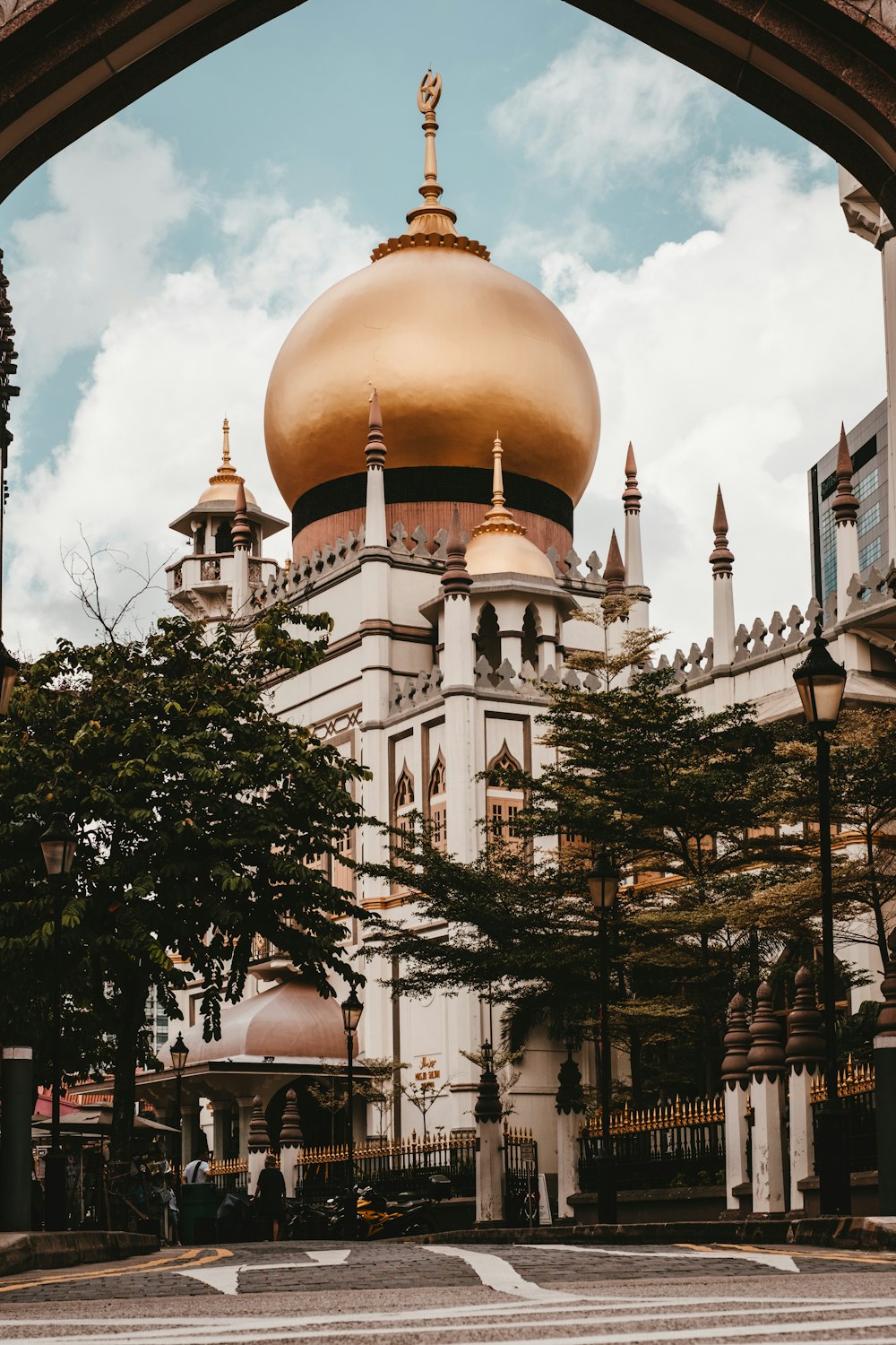 a large white building with a gold dome