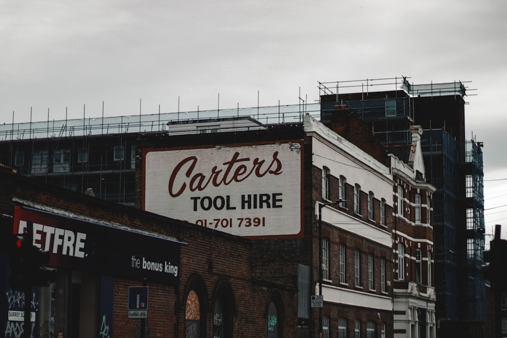 a sign on the side of a building advertising a tool hire
