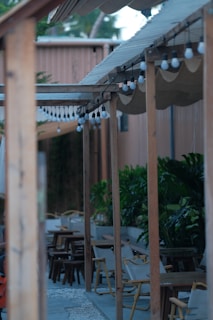 Garden area with a wooden pergola and soft lighting creating a relaxing atmosphere.
