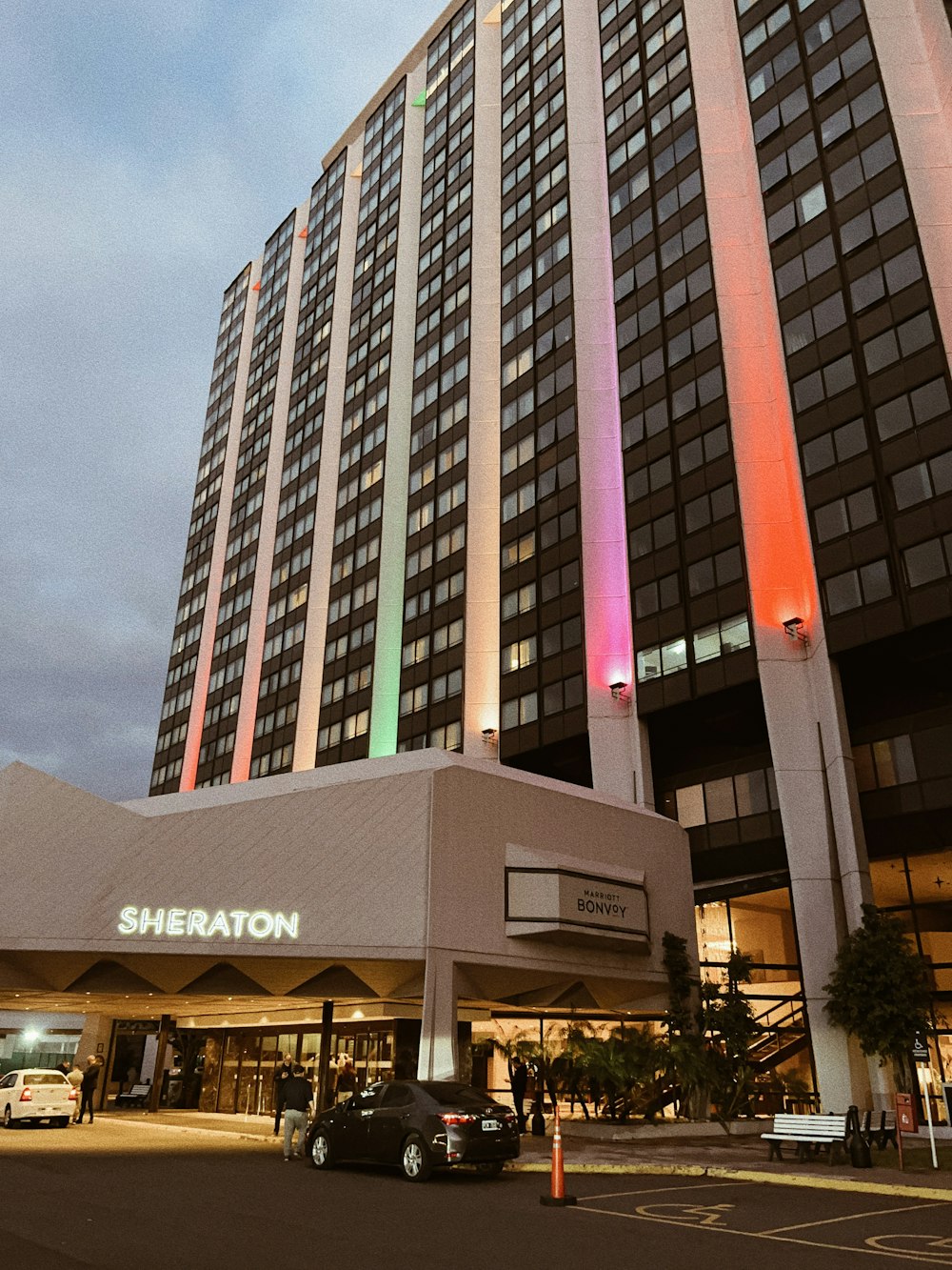 the sheraton hotel is lit up in rainbow colors