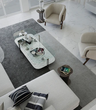 Elegant modern living room featuring a minimalist Swiss-inspired interior with a vintage Afghan rug as the centerpiece.