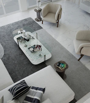 Modern minimalist living room arrangement with marble coffee table and sleek seating from Sano Furnishing