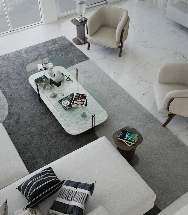 A sleek, modern living room featuring a beige sofa with black accent pillows and a minimalist coffee table