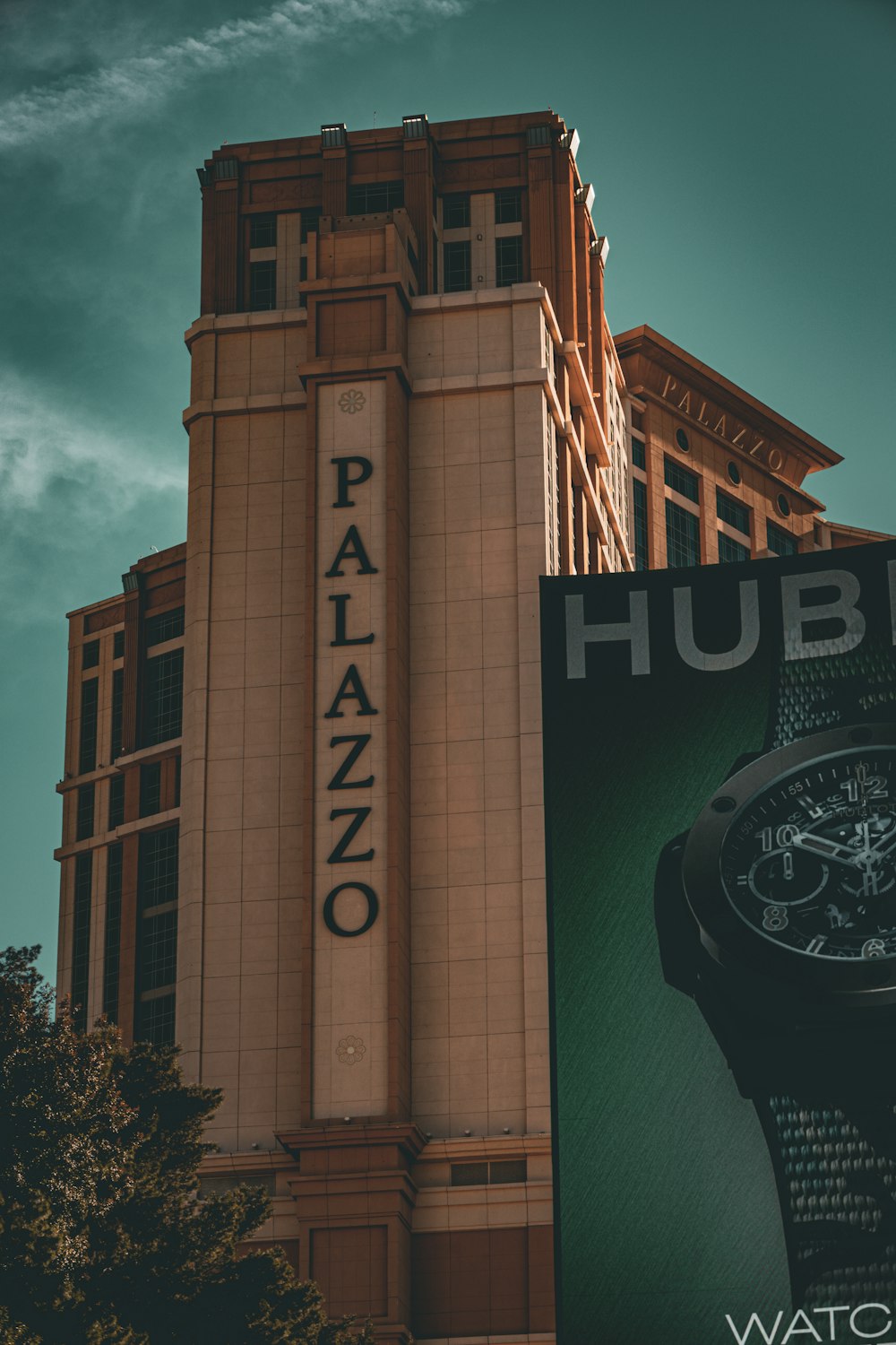 a watch advertisement on a building with a sky background