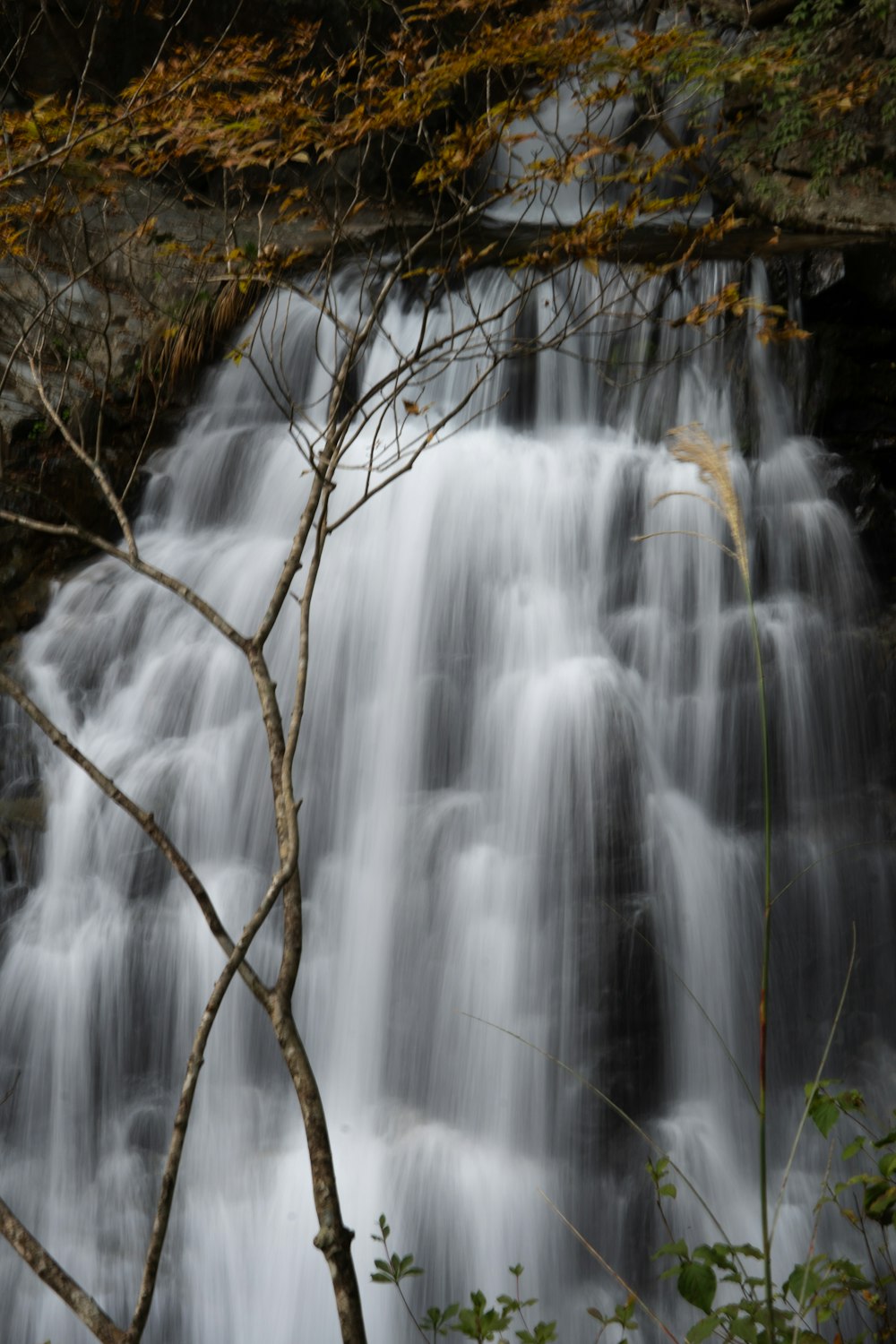 a waterfall with water cascading down it's sides