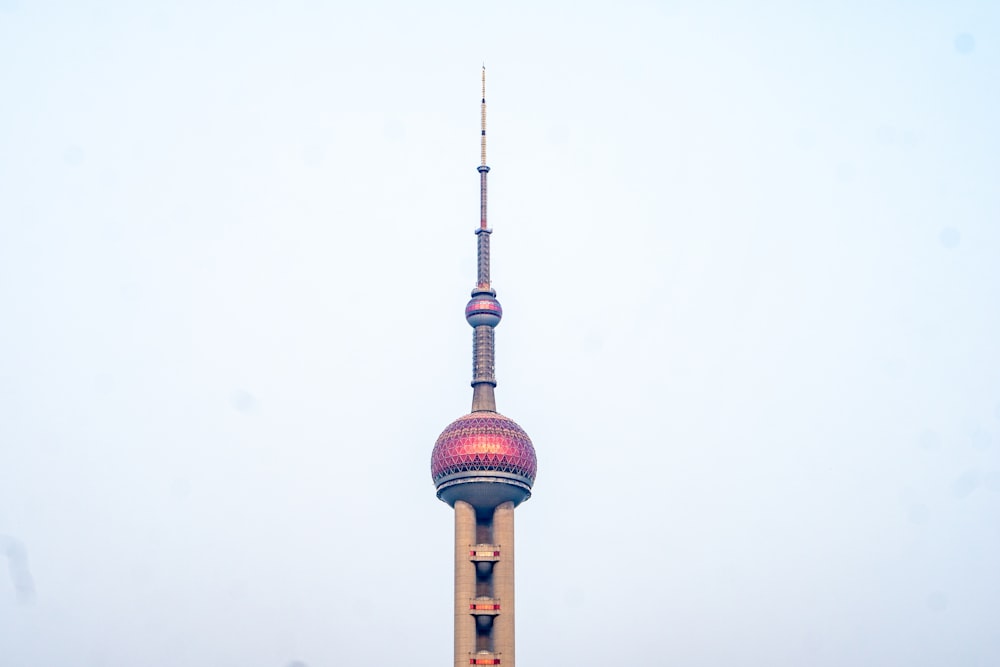 a very tall building with a very colorful top