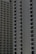 Two high-rise apartment buildings with multiple floors, featuring uniformly spaced windows and balconies.